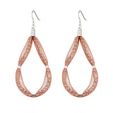 This large Teardrop earring design is a loop of sparkling Czech crystals set on a sterling silver hook and encased in a beautiful blush mesh.