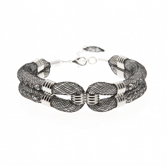 This silver plated woven mesh bracelet called 'Clove Cuff' is the perfect addition to the wardrobe. Its contemporary design is easy to wear at any age and is made with a 3cm extension chain