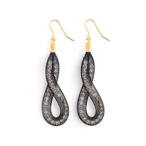 The Loop & Twist earrings are  grand in gesture and uniquely shaped. 